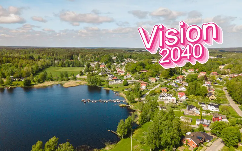 Vy över bostadsområde vid sjön Halen med texten Vision 2040.
